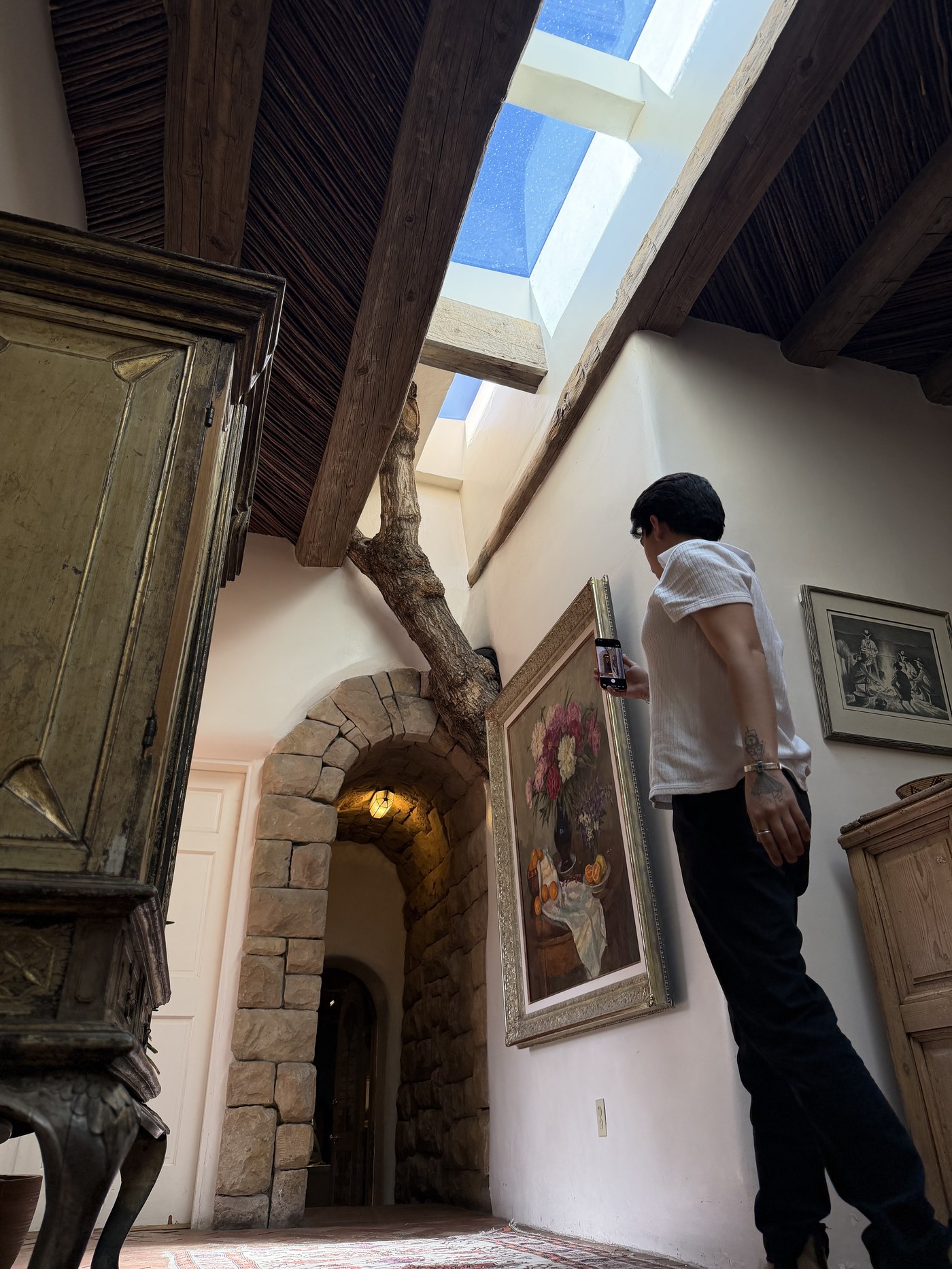 Aram Herrera composing a frame at a Santa Fe property