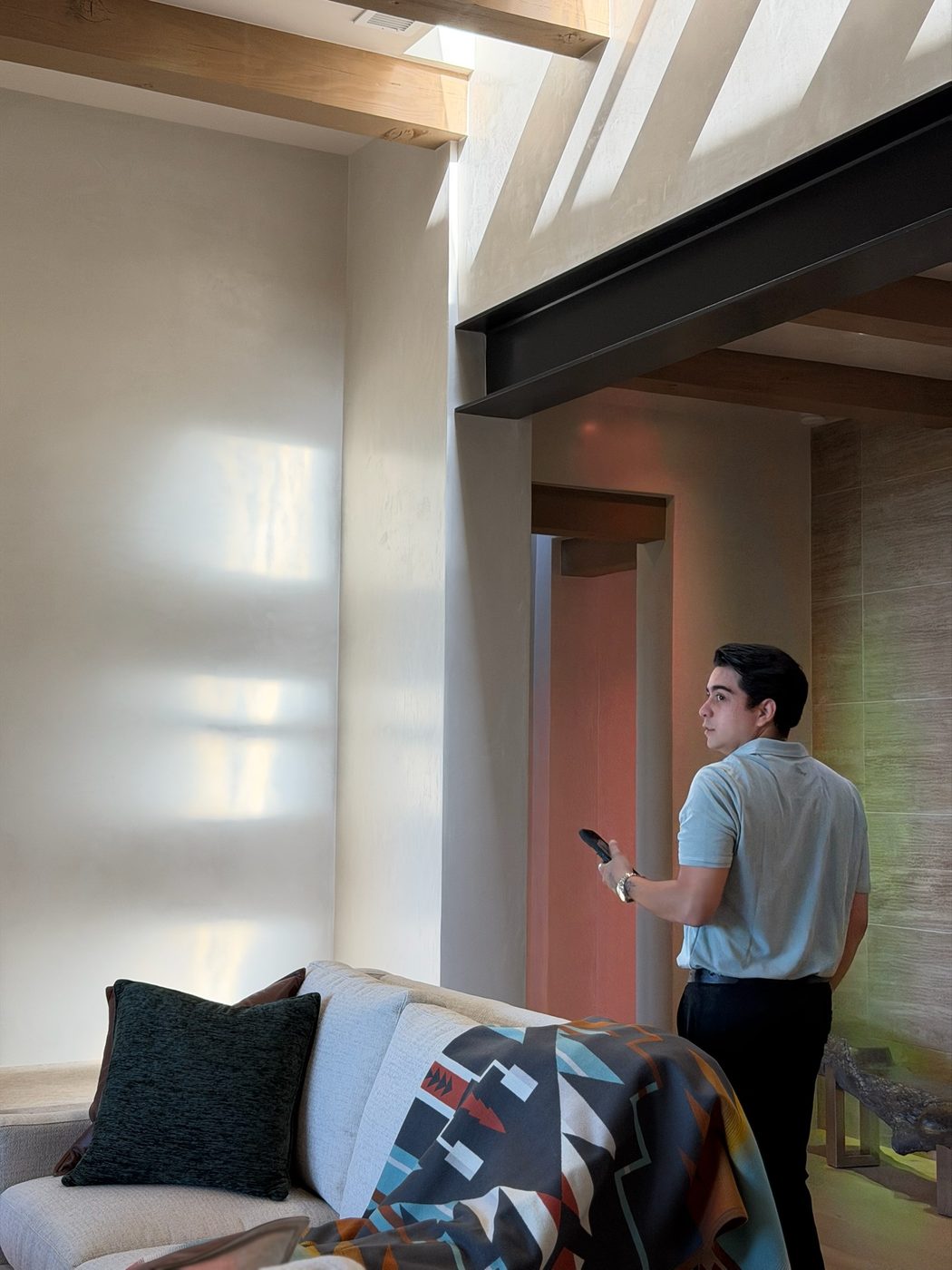 Aram studying light in a modern Santa Fe home